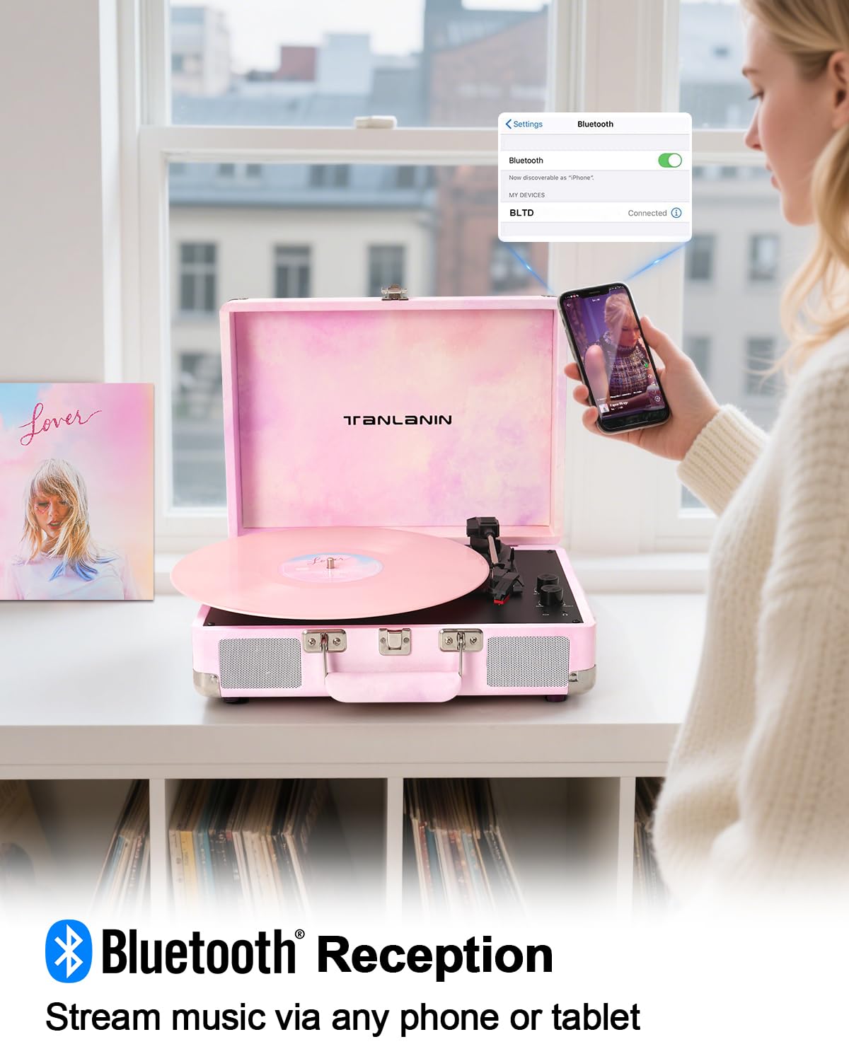 Tanlanin watercolor vinyl player in a suitcase design, portable and stylish.