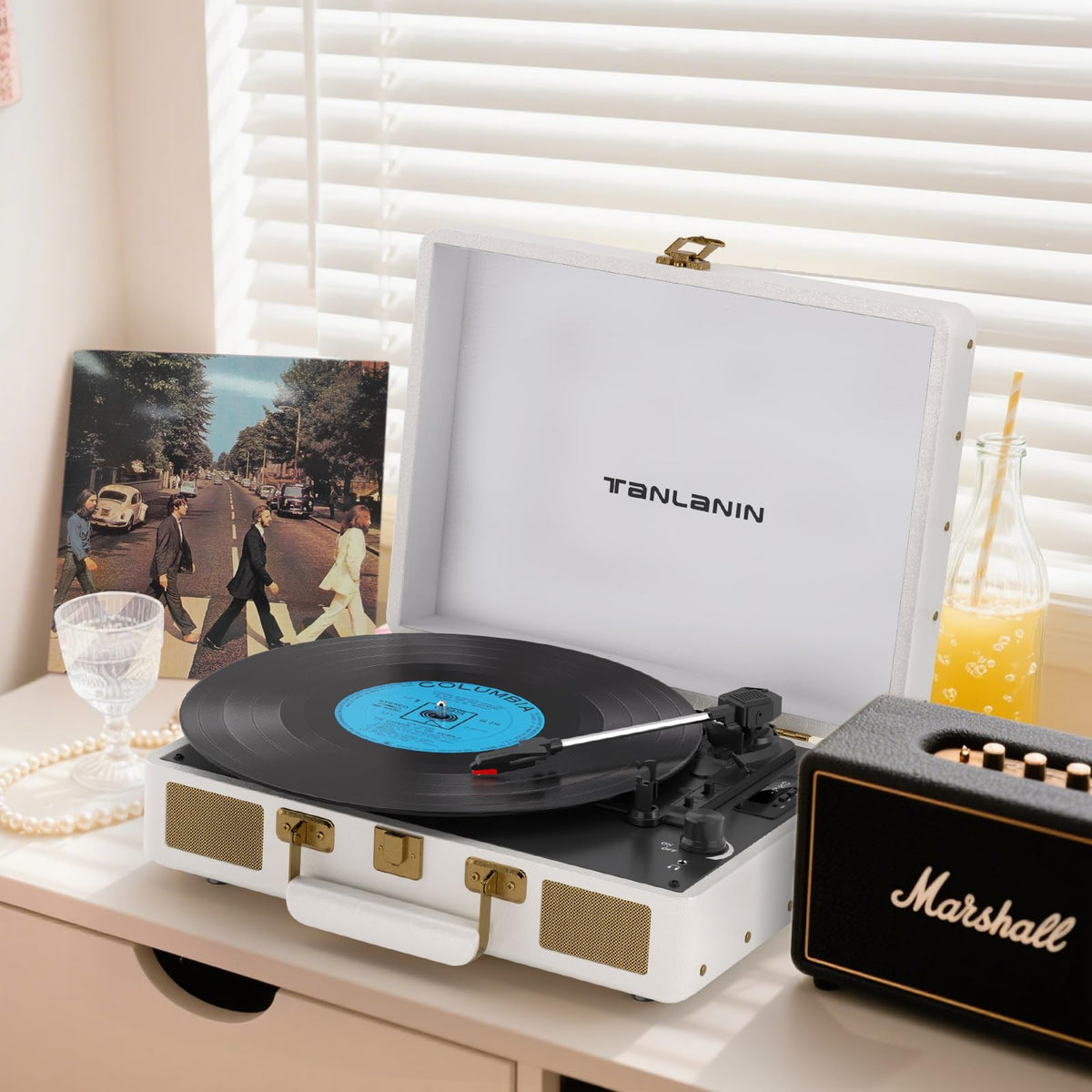 Tanlanin white leather finish adds retro style to any space.