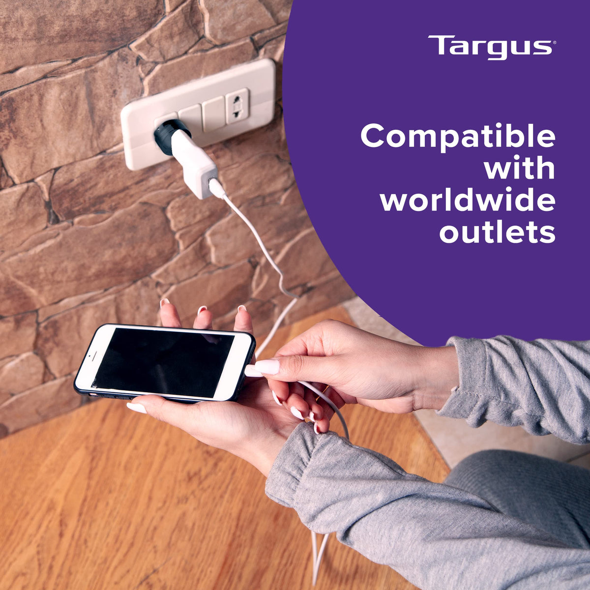 Traveler uses the Targus adapter abroad for reliable device charging.