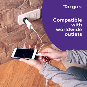 Traveler uses the Targus adapter abroad for reliable device charging.