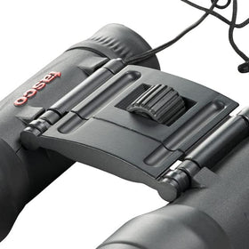 Tasco binoculars held in hand showing lightweight scale for all-day carry benefit