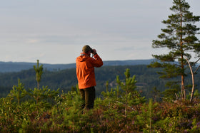 TASCO binoculars mounted at car window for scenic and roadside viewing