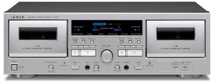 Teac W-1200 dual cassette deck front view in silver, ideal for playback and recording.