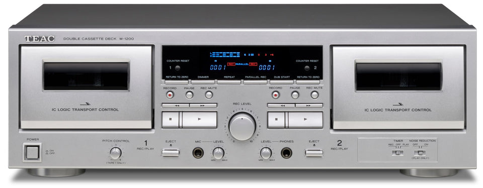 Teac W-1200 dual cassette deck front view in silver, ideal for playback and recording.