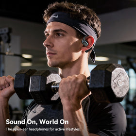 TECKNET earbuds beside travel items, practical for commuting and on-the-go benefit
