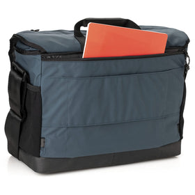 Tenba DNA 13 blue waterproof base keeps gear protected on damp surfaces.
