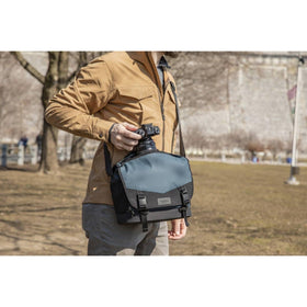 Tenba DNA 16 Slim Messenger Bag blue back view with waterproof base
