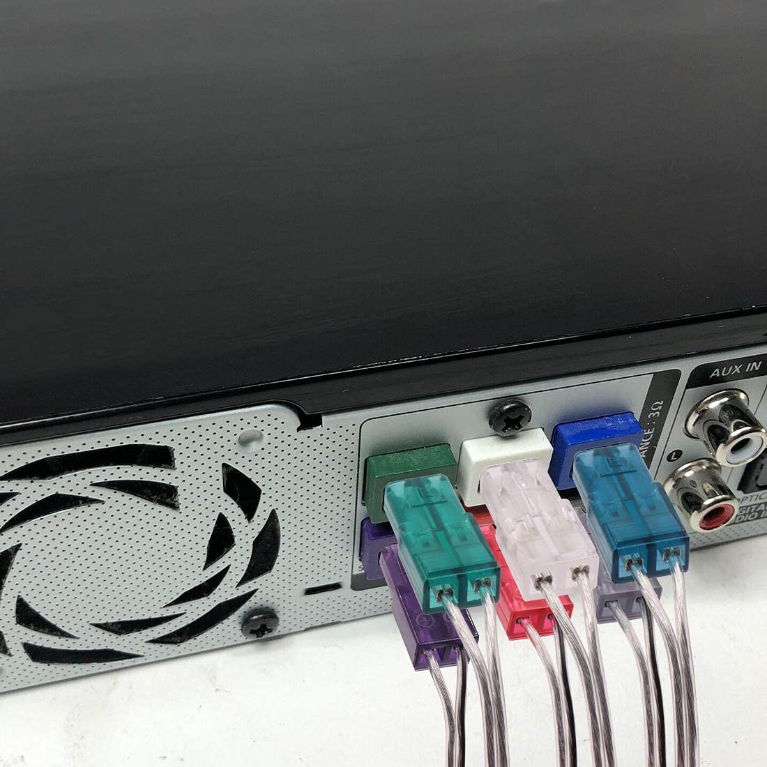 Tendodo wire plugged into a Samsung speaker terminal during installation for easy replacement