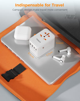 TESSAN held next to a passport and phone to show compact travel-friendly size