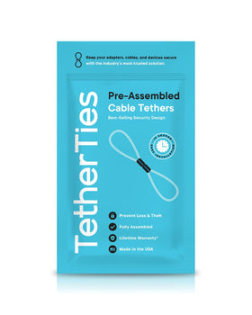 TetherTies anti-theft cable lock securing tools on a workbench.