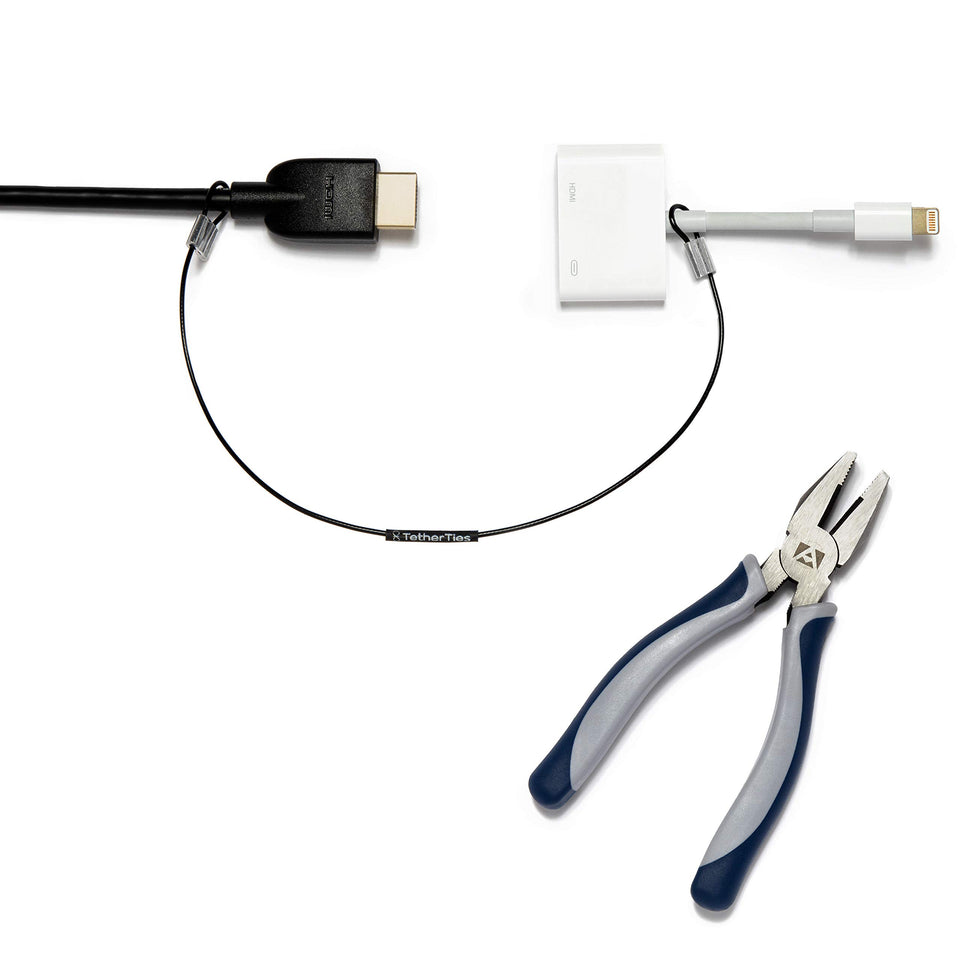 TetherTies secures a dongle with cable lock on a desk.