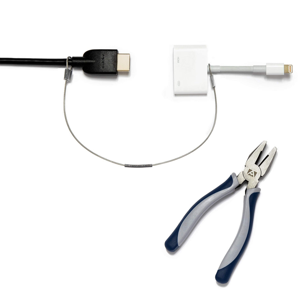 TetherTies durable steel cable securing a laptop dongle, reducing loss risk.