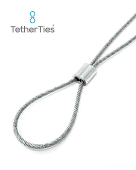 TetherTies securing tools on a workshop pegboard