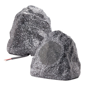 Theater Solutions 2R4G granite rock speaker on a patio for outdoor sound