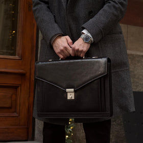 Time Resistance briefcase interior with laptop compartment for organized use.