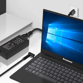 Tinkon adapter powering an HP laptop on a desk to illustrate everyday use and workspace convenience