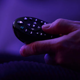 TiVo LUX backlit keypad close-up displaying clear keys for dark rooms