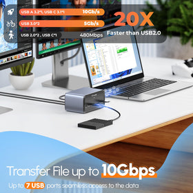 TobenONE next to laptop demonstrating compact size and space saving