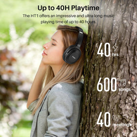 TOZO HT1 on home office desk showing comfortable listening during work benefit