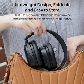 TOZO HT1 next to smartphone showing compact scale and portability benefit