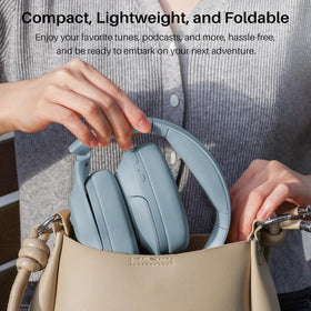TOZO HT2 carrying case open with cables and manual, showing neat storage and protection