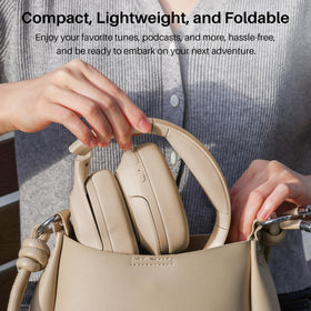Traveler using TOZO HT2 on airplane, demonstrating ANC performance and comfort