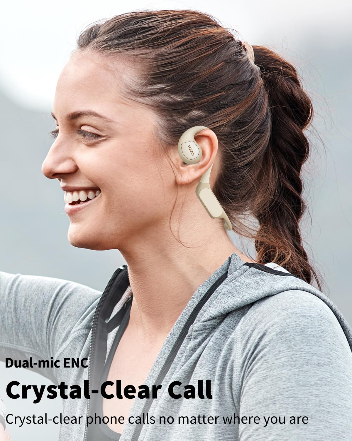 TOZO OpenReal worn on head showing secure fit for active use