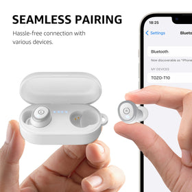 TOZO T10 held in hand for scale, showing lightweight compact design