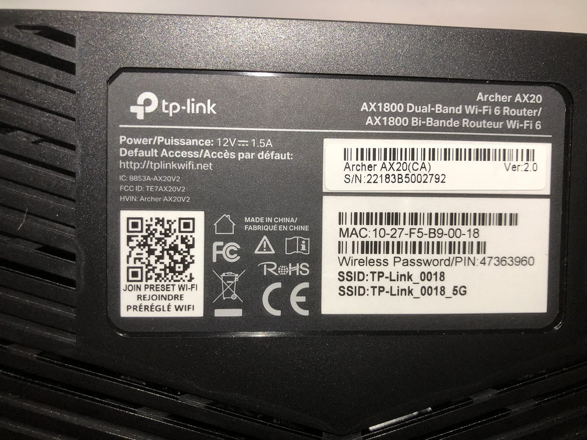 TP‑Link Archer AX20 packaging and accessories illustrating included cables and manual