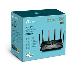 TP‑Link Archer AX4400 placed in living room demonstrating stronger whole‑home Wi‑Fi