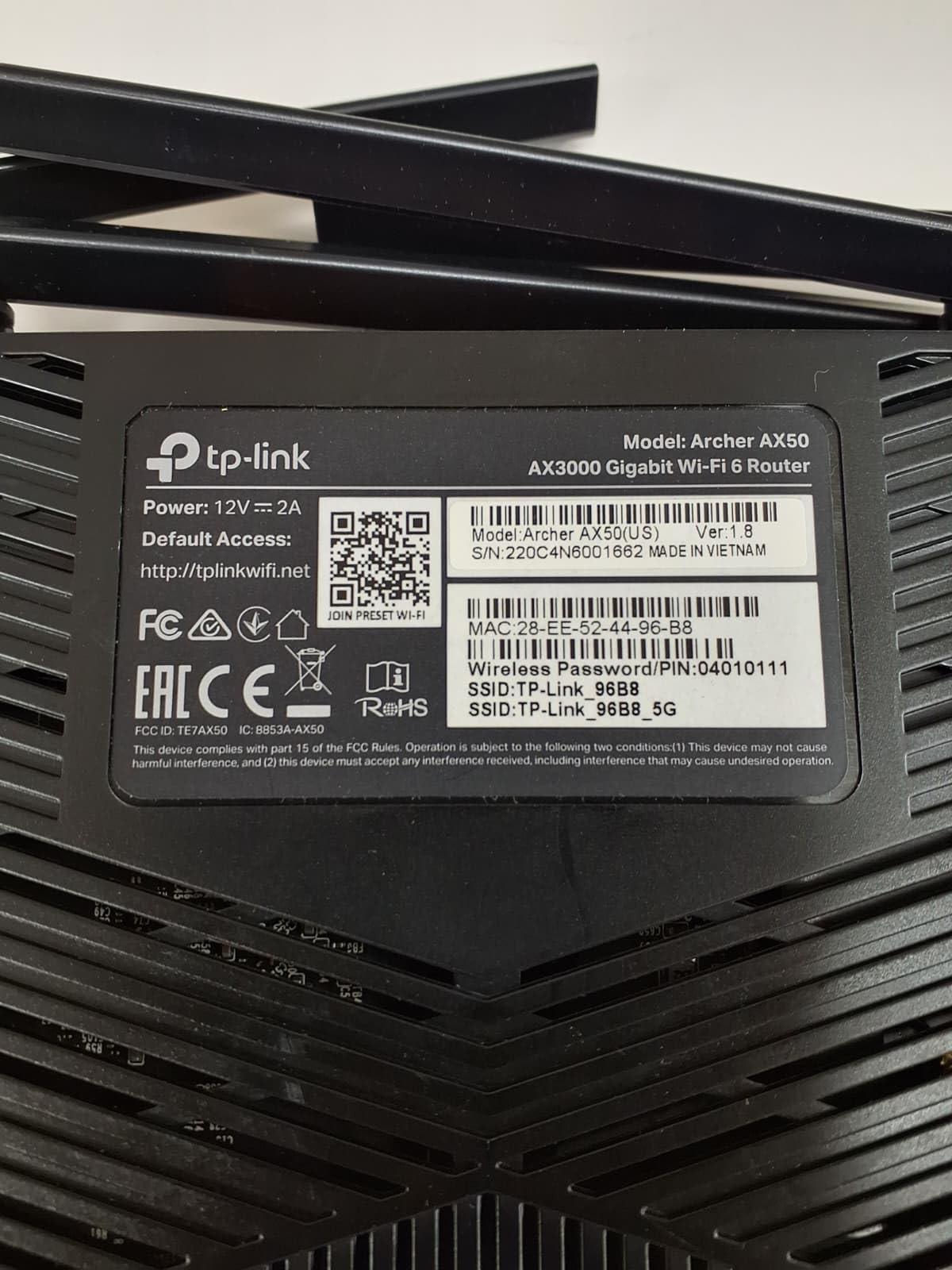 TP-Link Archer AX50 renewed packaging and handset showing inspected like‑new condition