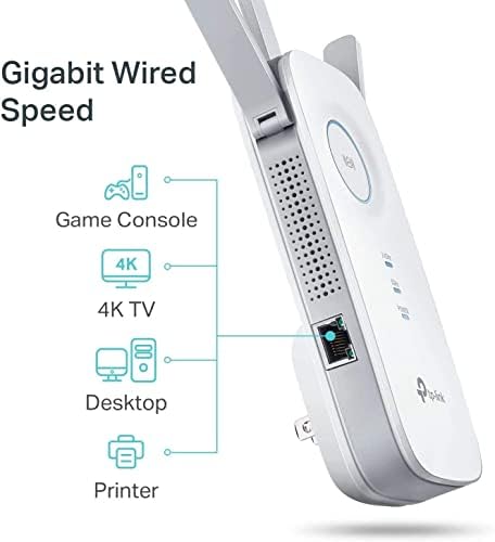 TP‑Link RE450 plugged into living room outlet extending Wi‑Fi to streaming devices