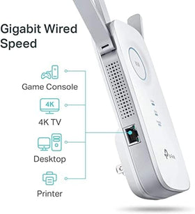 TP‑Link RE450 plugged into living room outlet extending Wi‑Fi to streaming devices