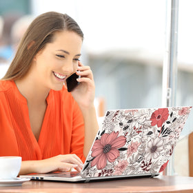 TracyArt laptop in use at a cafe showing stylish protection on the go