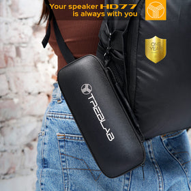TREBLAB CB-77 clipped to backpack outdoors showing rugged portability and on-the-go use