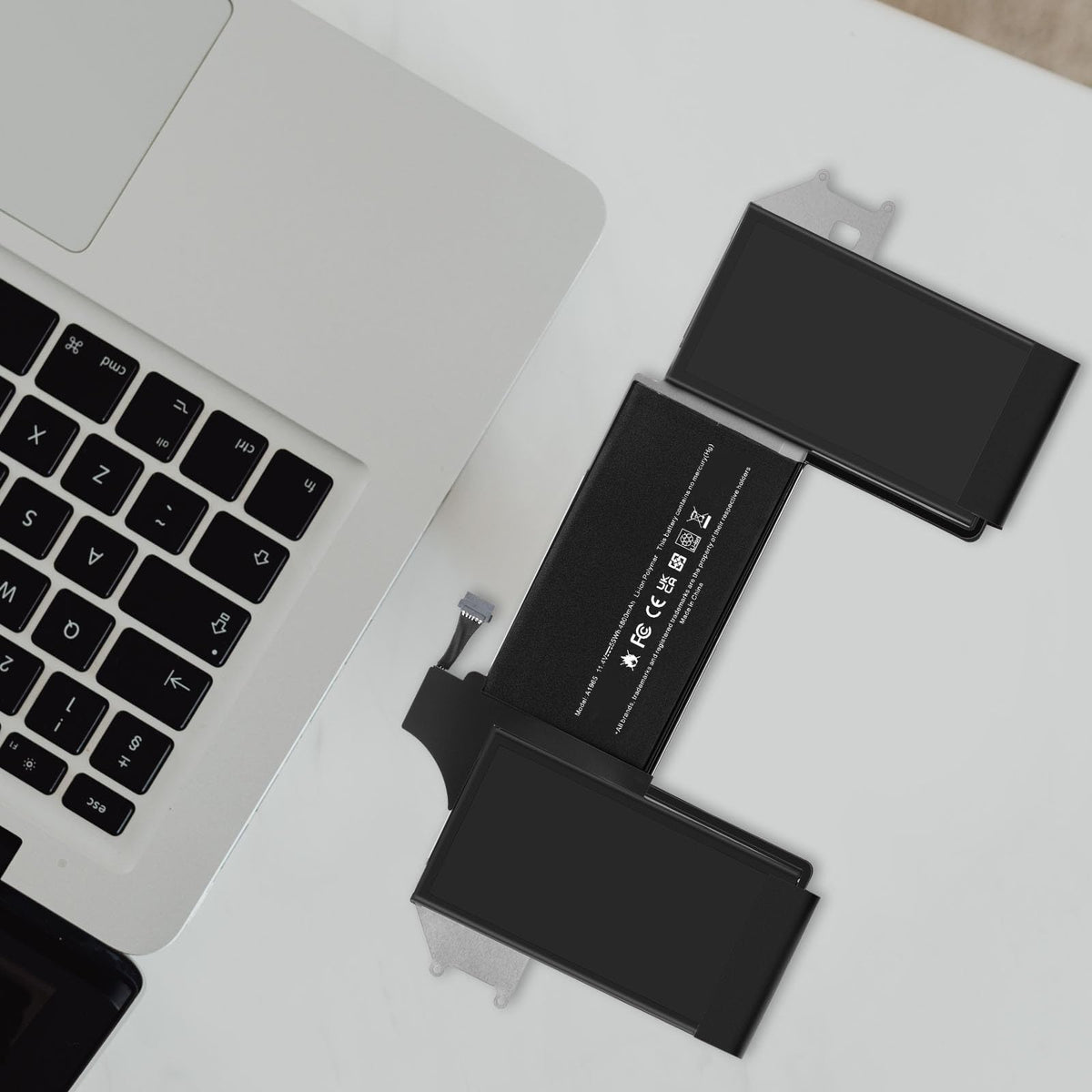 TREE.NB battery on a desk with laptop showing improved daily productivity and convenience