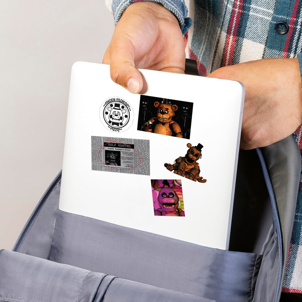 Five Nights at Freddy’s decal on notebook for personal expression.
