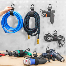 Trilancer wall mount hanger in use for tidy workshop cords and cables.