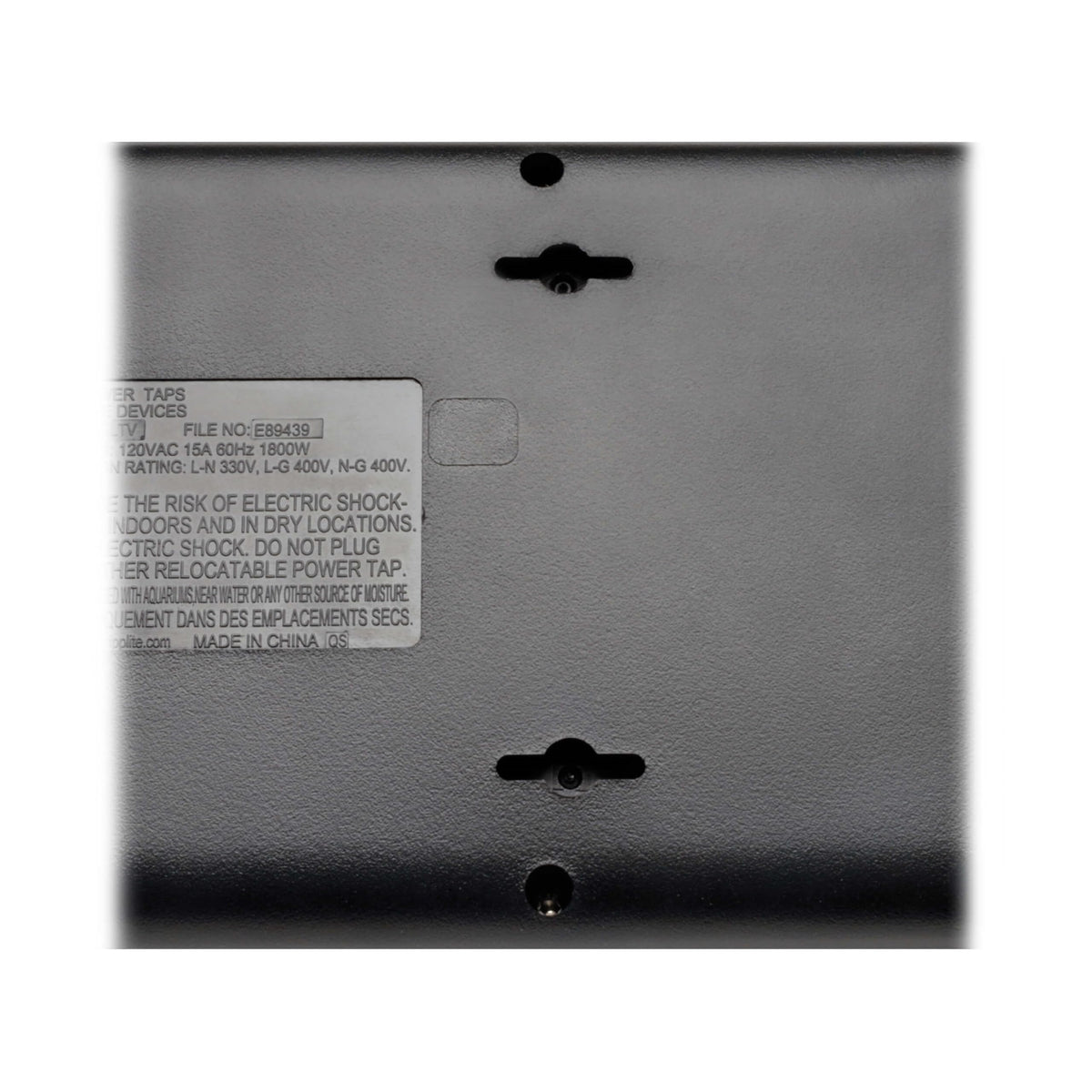 TRIPP LITE next to ruler showing length and size, clarifies outlet strip scale