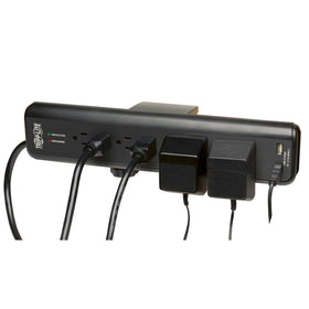 Tripp Lite close-up of adjustable clamp securing the surge protector to desk edge