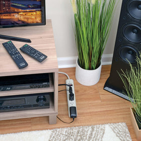 TRIPP LITE coiled 12-foot cord demonstrating reach for distant wall outlets