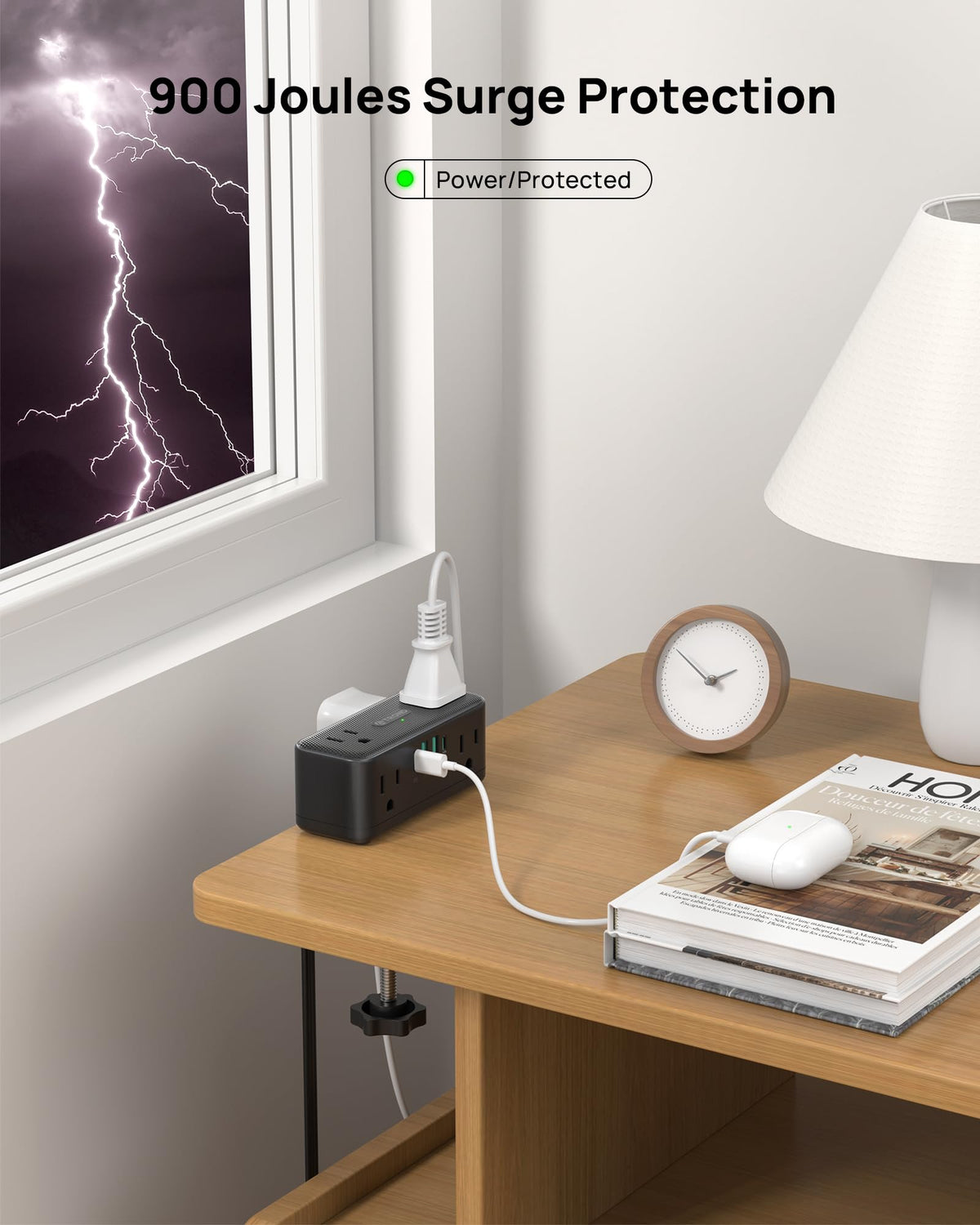 TROND power strip clamped to desk powering monitor, lamp, and phone efficiently