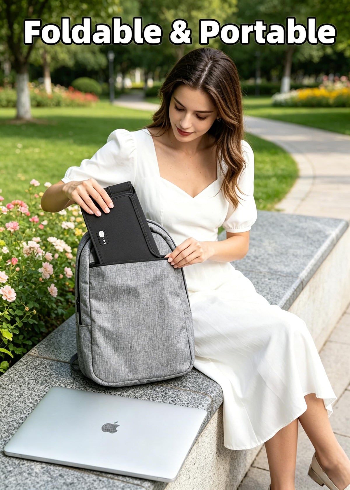 TT TYTX beside 15-inch laptop for clear size and fit reference