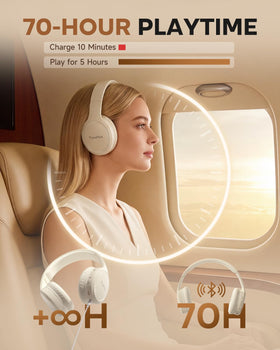 TuneFlux beige wireless headphones on a home office desk for focused listening.