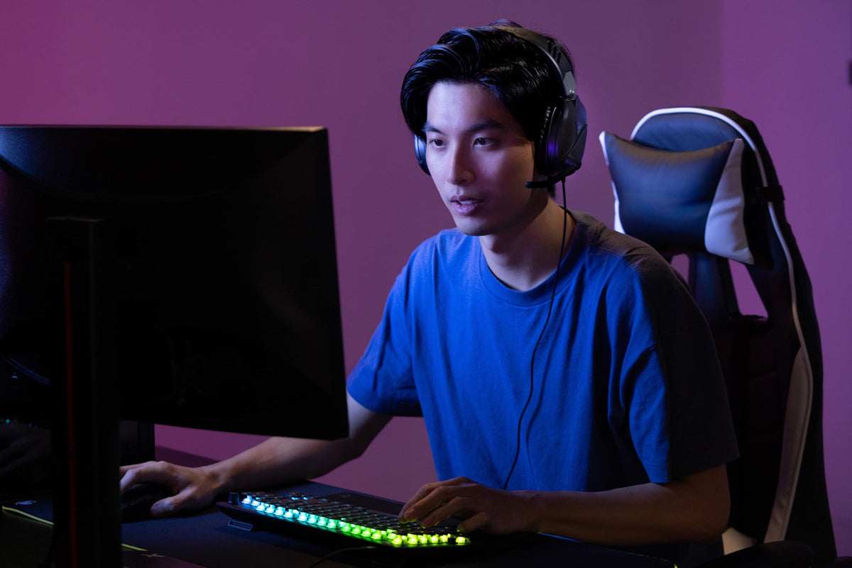 Turtle Beach Recon 70 next to a game controller for size and scale reference