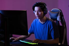 Turtle Beach Recon 70 next to a game controller for size and scale reference