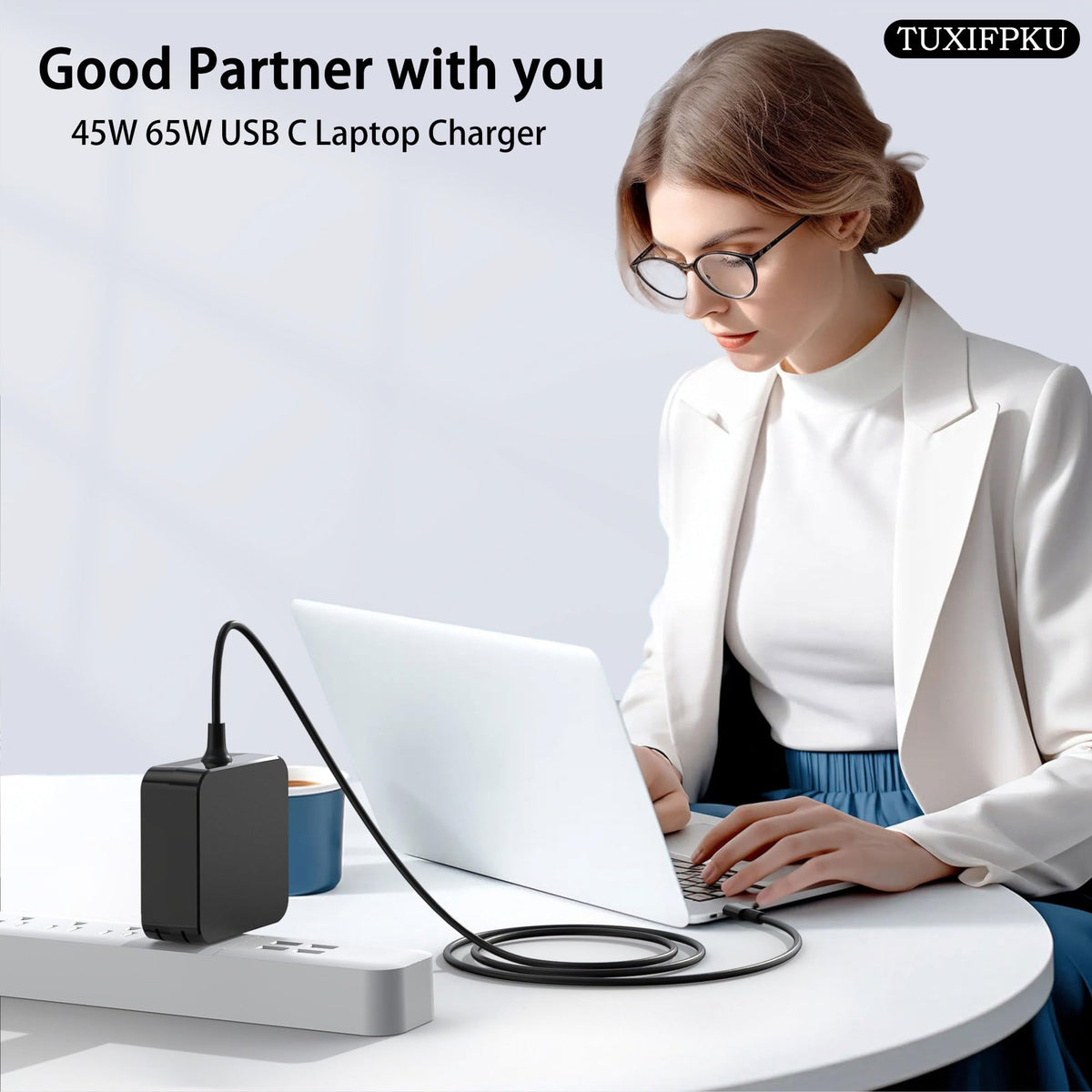TUXIFPKU 65W USB-C charger ready for travel and multiple devices.