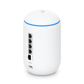 Ubiquiti Dream Router on a desk highlighting compact design for easy setup
