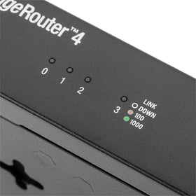 Ubiquiti EdgeRouter 4 desk-mount setup demonstrates space-saving placement.