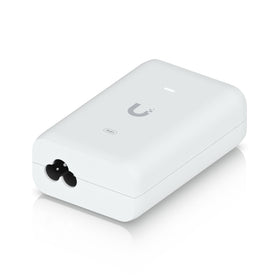 Ubiquiti PoE+ adapter compact size shown next to a ruler for space-saving installation